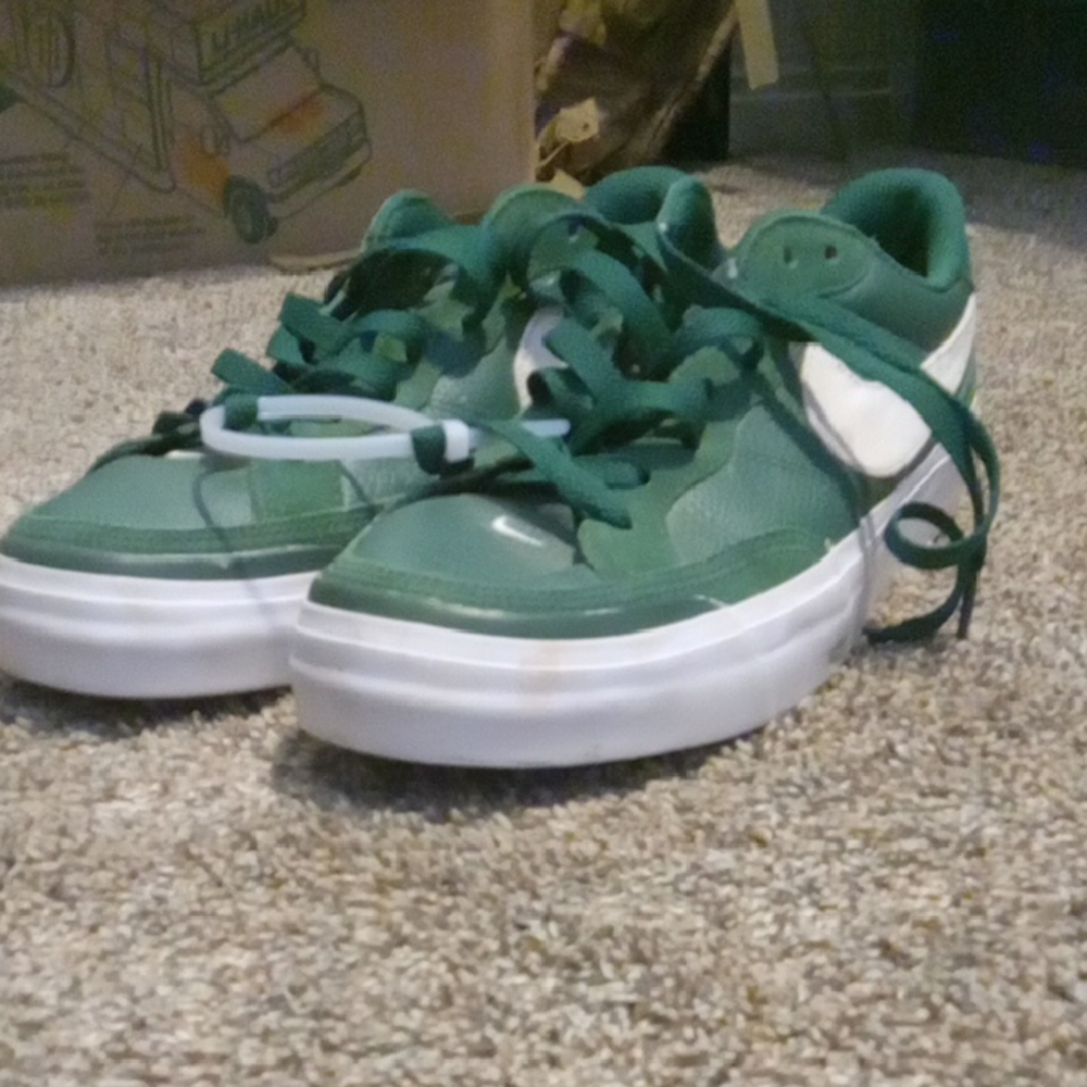 Nike Green and White Athletic Shoes with Classic Silhouette